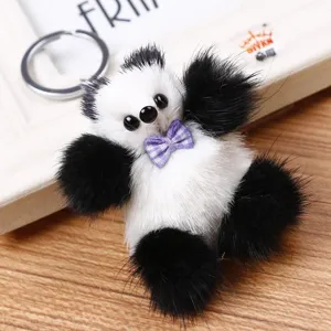 Lindo dije de bolso de felpa de panda en blanco y negro y llavero de coche con lazo.