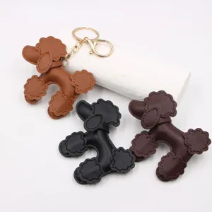 Leather poodle dog keychain pendant, cute curly puppy bag charm and car key ring.