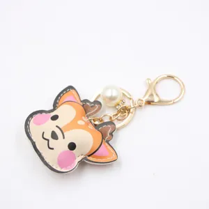 Cute leather deer keychain with pearl pendant, stylish bag charm and metal clasp accessory.