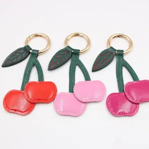Leuke lederen kers sleutelhanger tas bedel en auto sleutelring accessoire voor vrouwen