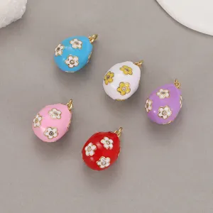 Colorful enamel egg charms with floral crystal details, perfect for DIY jewelry making and necklaces.