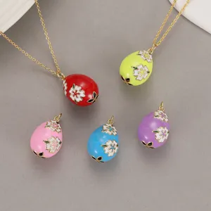 Colorful enamel Easter egg pendant necklace set with floral design, vintage fashion jewelry.