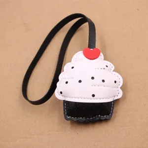 Cute cupcake leather bag charm black and white keychain stylish backpack hanging accessory.