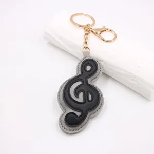 Portachiavi in pelle chiave di violino ciondolo borsa simbolo musicale anello metallo.