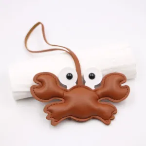 Cute crab leather bag charm keychain, premium brown leather pendant for stylish handbags.