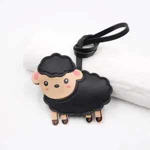 Close-up of black sheep leather bag charm pendant detail showing cute design texture.