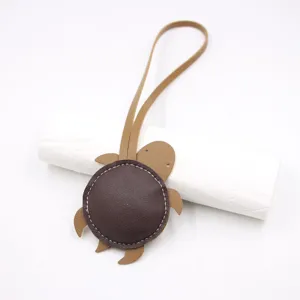 Cute leather turtle bag charm and lanyard pendant, perfect fashion accessory for handbags and keys.