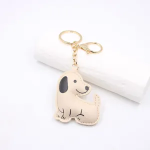 Cute cartoon puppy leather keychain detail, premium stuffed dog pendant with gold key ring.