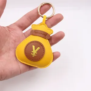 Portachiavi a sacchetto soldi stampato in oro, squisito design in pelle PU per borse.