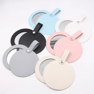 Portable round leather makeup mirror bag pendant set, multi-color compact mirror for daily use.