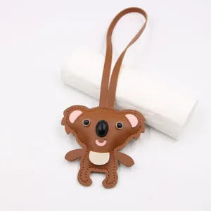Cute koala leather keychain bag pendant cartoon animal doll backpack accessory brown strap.