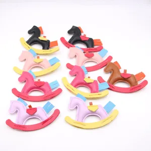 PU leather rocking horse keychain pendant, cute bag charm accessory in various colors.