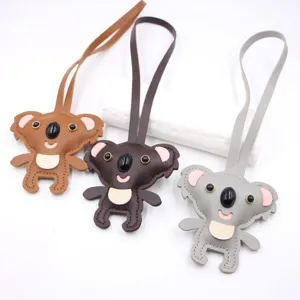 Cute koala leather pendant detail shot, bag charm accessory, cartoon animal backpack decoration.