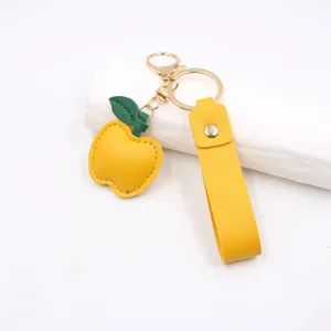 Yellow apple leather keychain cute bag pendant with gold hardware daily accessory detail