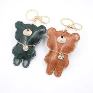 Crocodile pattern leather bear keychain and cute bag charm with sparkling rhinestones, ideal accessory.