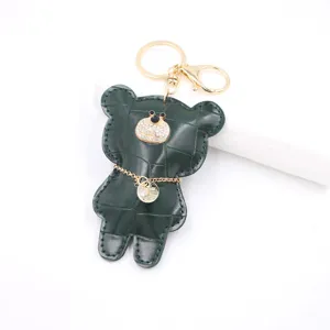 Green crocodile texture leather bear keychain with rhinestones, stylish bag charm and accessory.