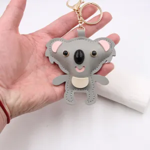 Cute koala leather keychain bag charm, stylish animal pendant accessory for backpack.