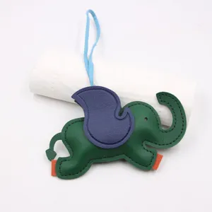 Leather elephant bag charm with vibrant color contrast, perfect purse pendant for stylish denim.