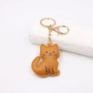 Schattige lederen kat sleutelhanger, cartoon dier tas hanger en autosleutel accessoire.