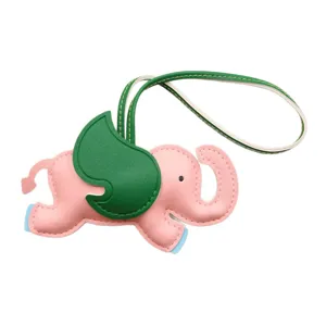 Pink leather elephant bag charm with green wings, stylish color-blocking keychain pendant.
