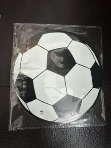 Soccer ball theme party hanging decoration detail shot, round shaped card in clear bag.