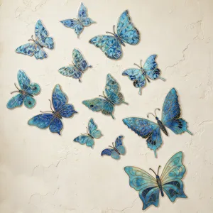 Close-up detail of 3D blue mosaic butterfly stickers with gold foil, perfect for room walls.