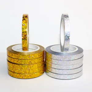 Holographic balloon ribbon details, shiny gold and silver decorative tapes for party decor.