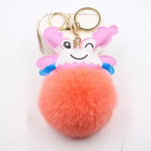Cute crab plush ball keychain detail, soft fluffy faux fur bag accessory and car key ring.