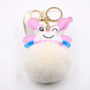 Cute pink crab plush pom-pom keychain, soft faux fur bag charm and car key ring accessory.