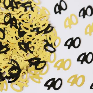 Goldene und schwarze Nummer 40 Konfetti Detailaufnahme für Geburtstag Party Tischdeko