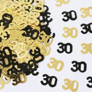 Gold und schwarzes Nummer 30 Konfetti fuer Geburtstag Party Tischdekoration und Event Dekoration.