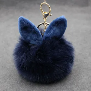 Dark blue fluffy rabbit ear pom pom keychain plush bag charm cute furry pendant accessory for keys.
