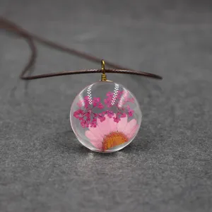 Dried flower glass pendant necklace crystal daisy resin jewelry botanical detail close up