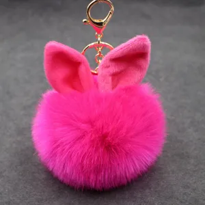 Plush rabbit ear keychain, hot pink fluffy pom pom bag charm, cute metal clasp pendant accessory.