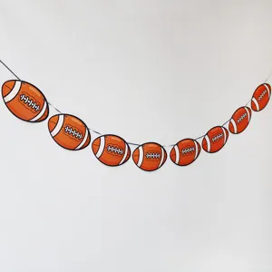 Football theme party hanging banner detail, perfect for sports birthday decoration setup.
