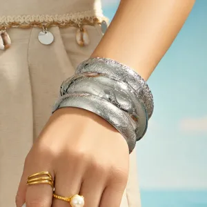 Stunning wide cuff bracelet featuring intricate engraved floral patterns, stylish women jewelry.