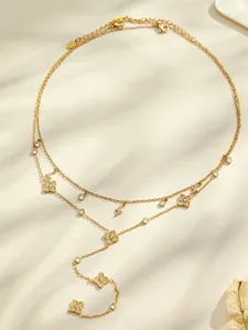 Detailed view of the elegant double layer Y necklace featuring sparkling zircon clover pendants.