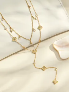 Detail shot of clover zircon Y-necklace, double-layer design with lightning and sparkling stones.