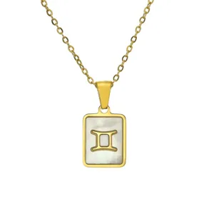 Detailed view of 18k gold plated Gemini zodiac necklace with white shell inlay.