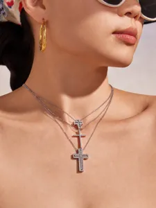 Detailed shot of multi-layer paved cross pendant necklace, elegant light luxury clavicle chain.