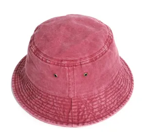 Detail shot of vintage washed denim bucket hat, casual solid color flat top design.