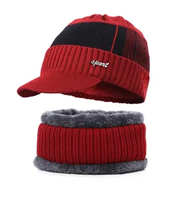 Detail view of winter fleece lined knit hat and neck warmer set in red and black colorway.