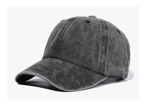 Close-up of the vintage washed grey plain baseball cap detail, showing textured cotton fabric.