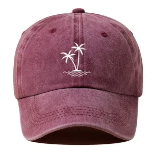 Vintage washed cotton baseball cap featuring embroidered white palm trees detail for summer style.