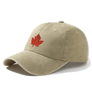 Vintage washed cotton baseball cap with red maple leaf embroidery for outdoor sun protection.