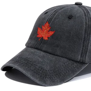 Washed vintage baseball cap with red maple leaf embroidery, casual sun hat for outdoor travel.