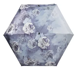 Detail shot of the compact folding umbrella showcasing its elegant purple watercolor rose floral pattern.