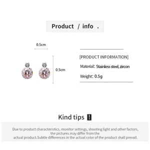 Detailed view of minimalist pink zircon stud earrings with stainless steel post design.