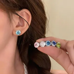 Colorful zircon stud earrings detail view featuring multi-color round threaded pieces.
