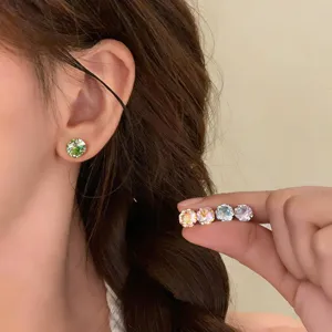 Colorful zircon round stud earrings detail shot, stylish Korean ins fashion jewelry accessory.